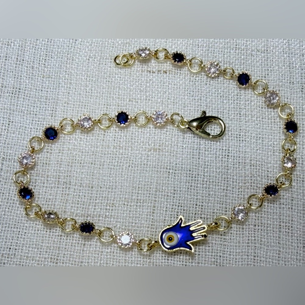 Evil eye bracelet,gold plated clear/blue CZ stones,enamel Hamsa hand charm.7.75”